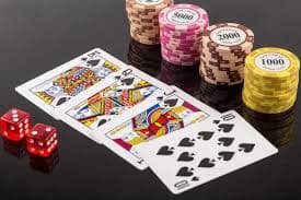 Live dealer casino table with multiple players and host commentary feed